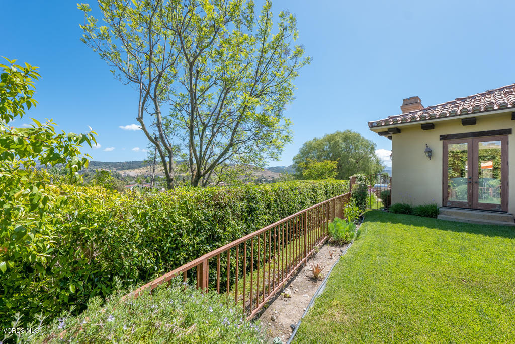 969 Rancho Road Thousand Oaks, CA 91362 - Photo 40 of 54 a view of a house with a small yard