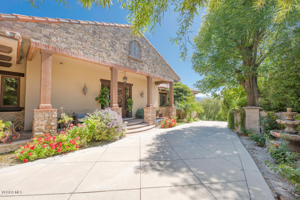 969 Rancho Road Thousand Oaks, CA 91362 - Photo 41 of 54 a view of a house with potted plants