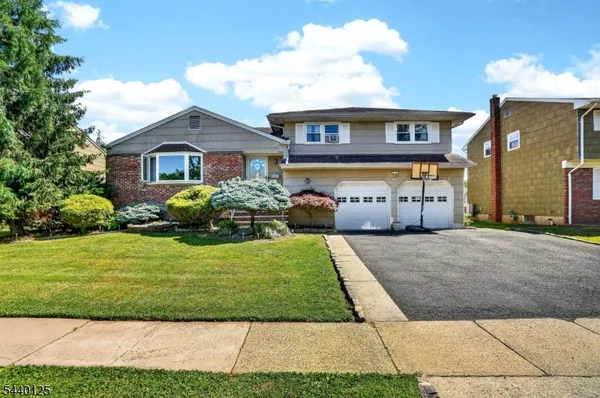 a view of house with yard and entertaining space