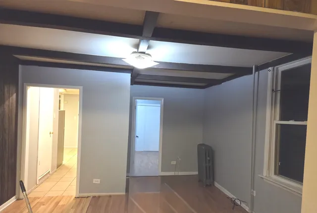 a view of room with a ceiling fan