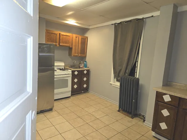 a kitchen with stainless steel appliances a refrigerator and a stove