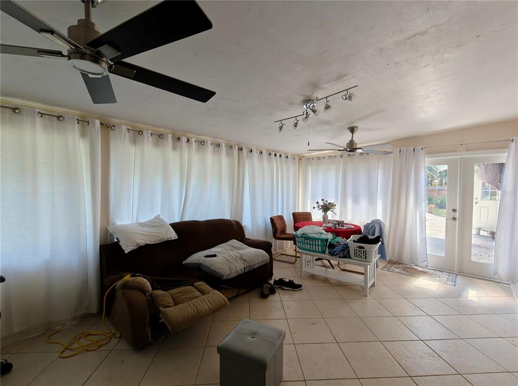 2305 Northwest 48th Terrace Gainesville, FL 32606 - Photo 12 of 20 a living room with furniture and a window