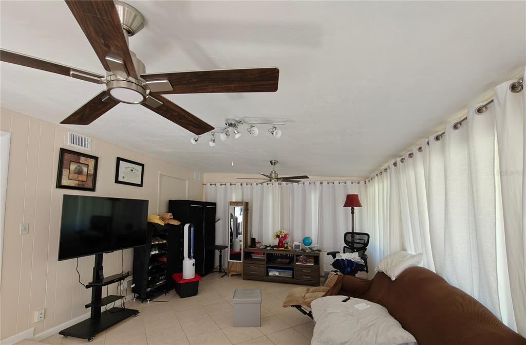 2305 Northwest 48th Terrace Gainesville, FL 32606 - Photo 13 of 20 a living room with furniture and a window