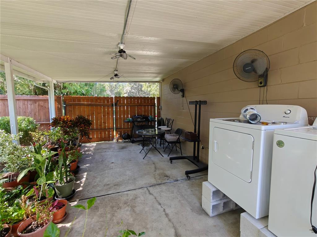 2305 Northwest 48th Terrace Gainesville, FL 32606 - Photo 16 of 20 a view of a room with furniture and a garage