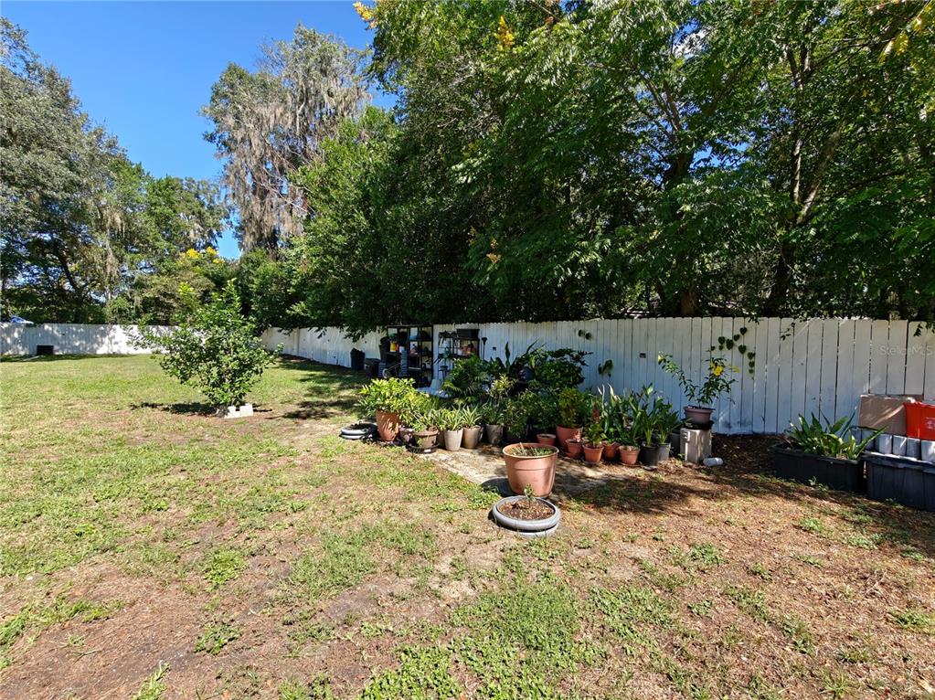 2305 Northwest 48th Terrace Gainesville, FL 32606 - Photo 17 of 20 a view of a backyard with sitting area