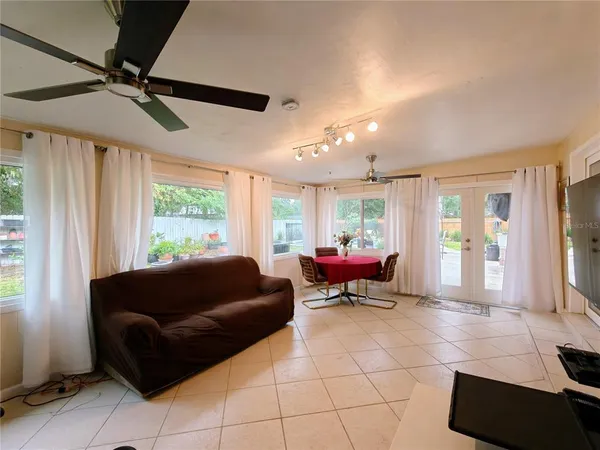 a living room with furniture and a window