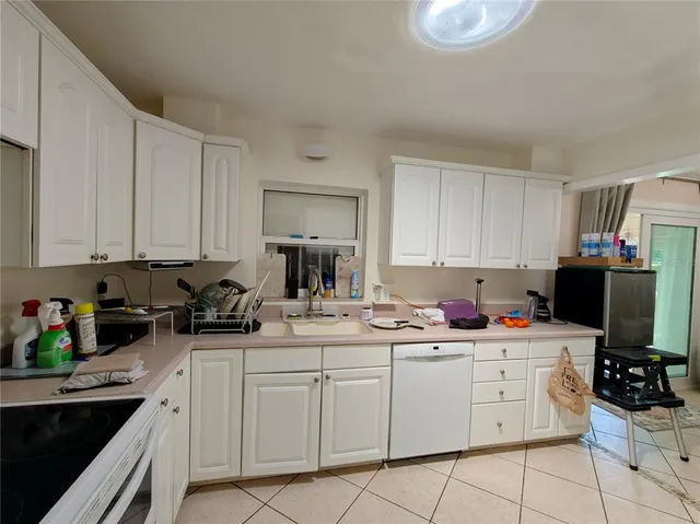 a view of a hallway with wooden shelves