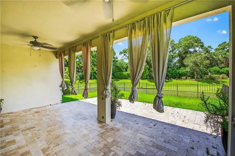 a view of a house with a backyard and a garden