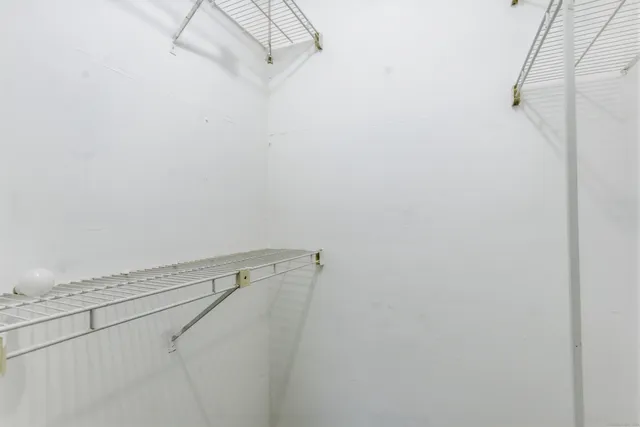 a view of a room with racks on the wall