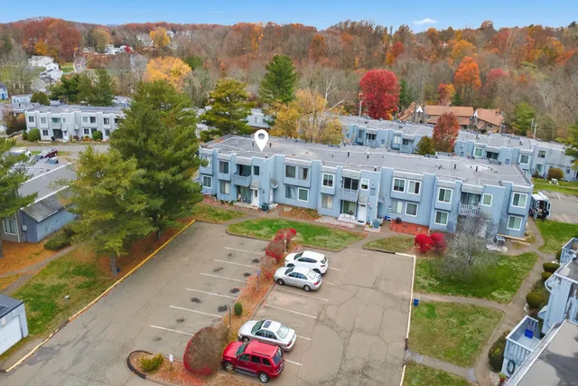 an aerial view of house with a garden