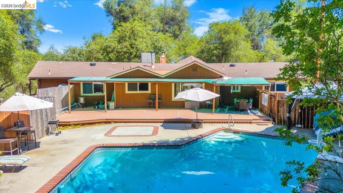 8733 Fraguero Road Sonora, CA 95370 - Photo 59 of 73 Rectangular swimming pool with brick coping and integrated steps