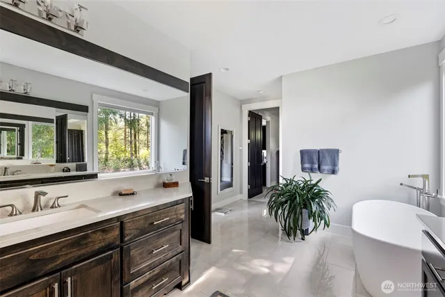 a livingroom with workspace and a window