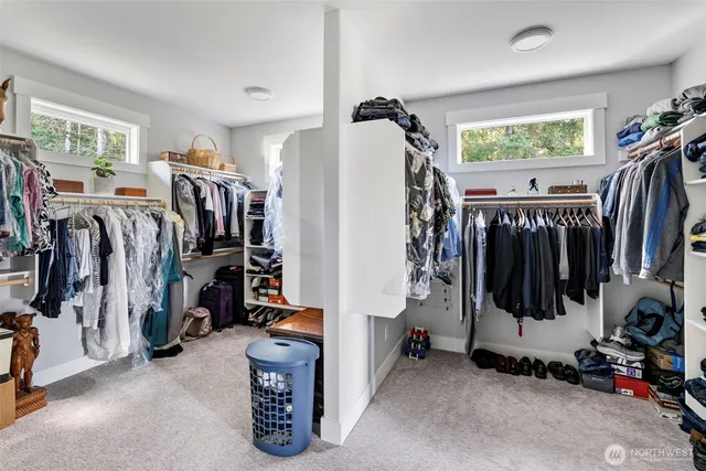 a bedroom with furniture and a gym equipment