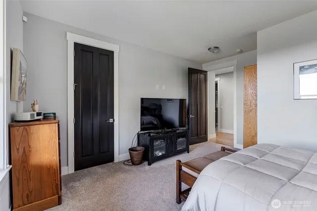 a bathroom with a double vanity sink toilet and a mirror