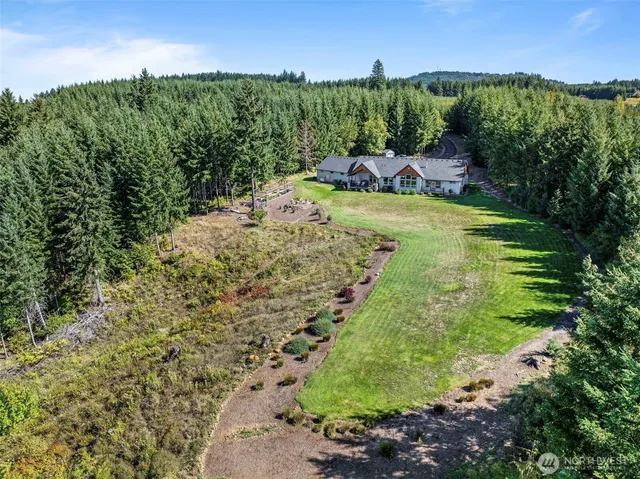 a view of house with garden and entertaining space