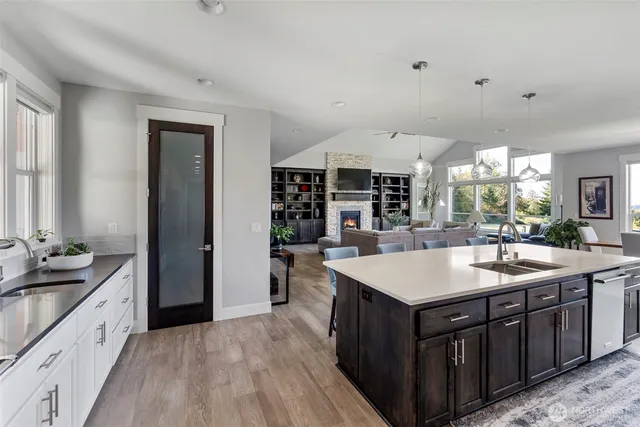 a view of a dining room with furniture and chandelier