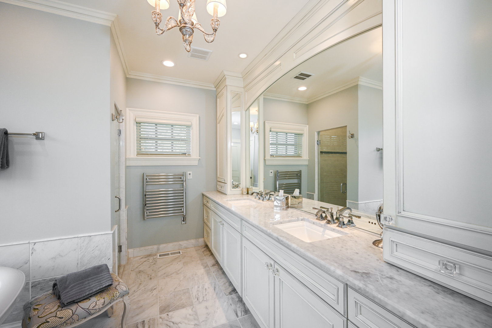 Undisclosed Address Glen Ellyn, IL 60137 - Photo 28 of 45 a spacious bathroom with a double vanity sink a mirror and a shower