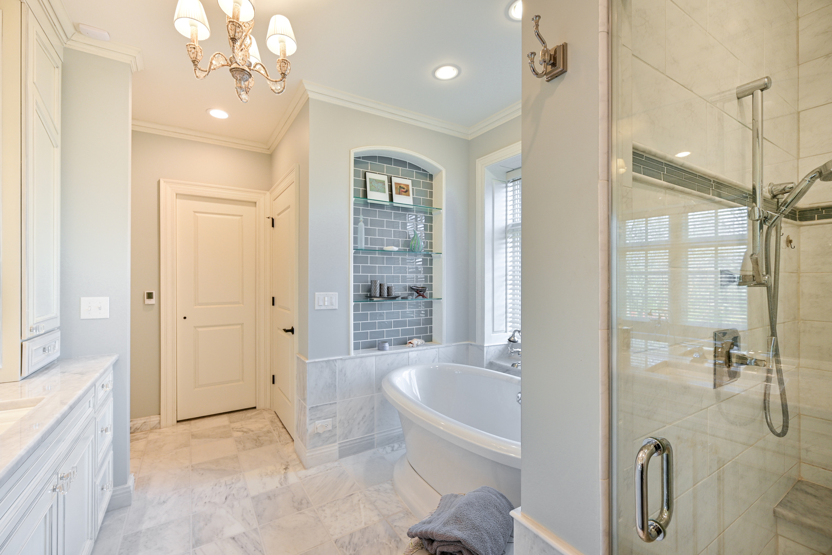 Undisclosed Address Glen Ellyn, IL 60137 - Photo 29 of 45 a spacious bathroom with a granite countertop sink a mirror a bathtub and shower