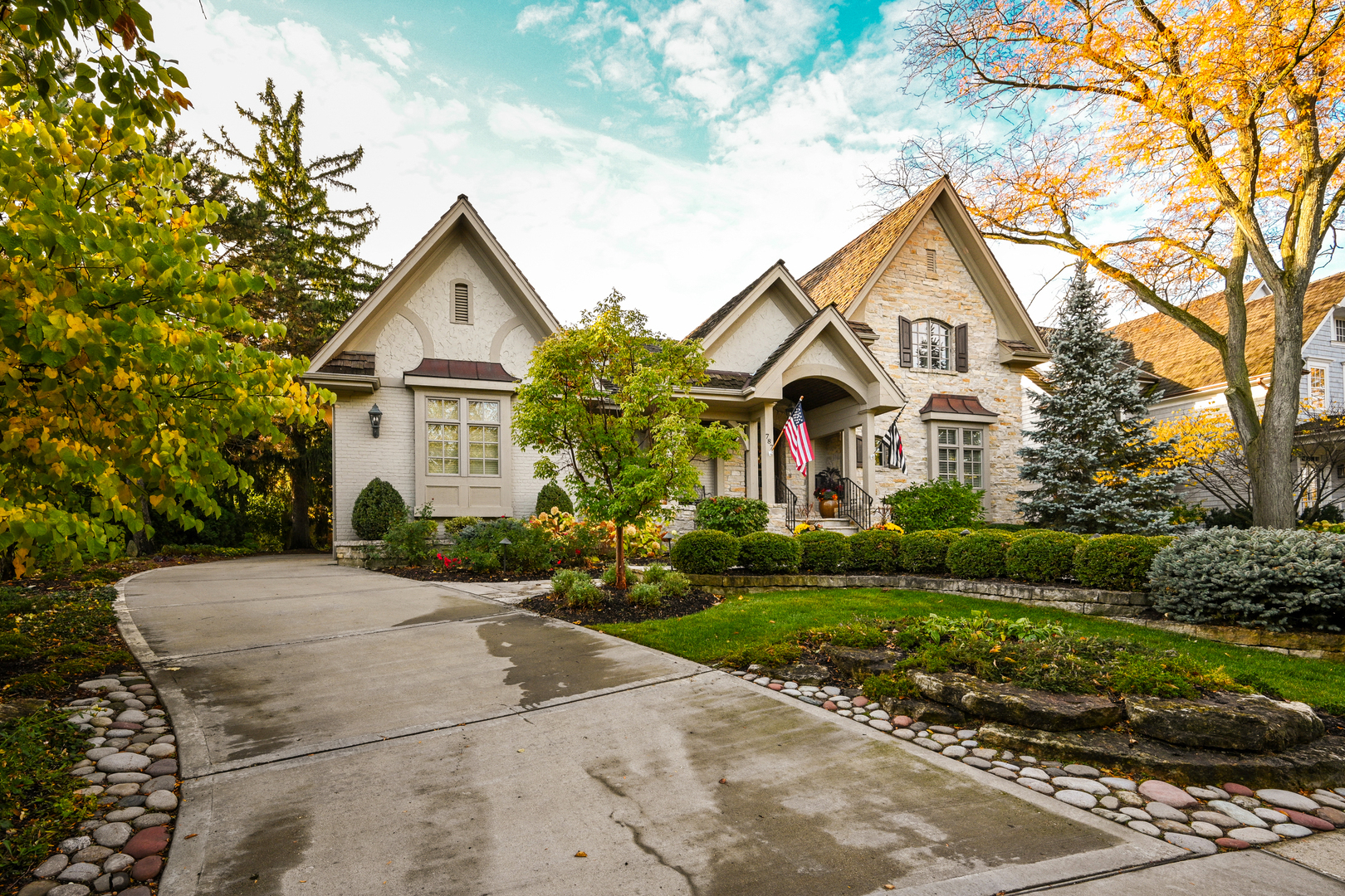 Undisclosed Address Glen Ellyn, IL 60137 - Photo 3 of 45 a front view of a house with a yard and garage