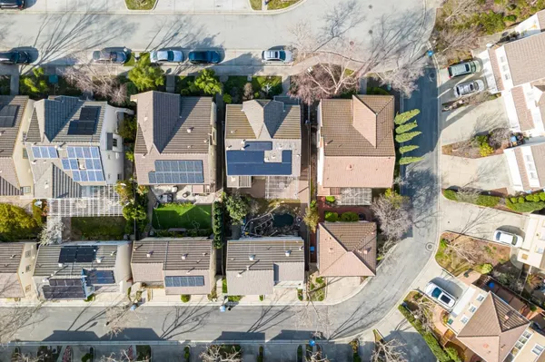 an aerial view of multiple houses with yard