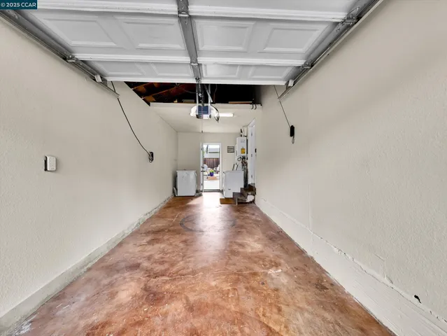 a view of a livingroom with a ceiling fan and entryway