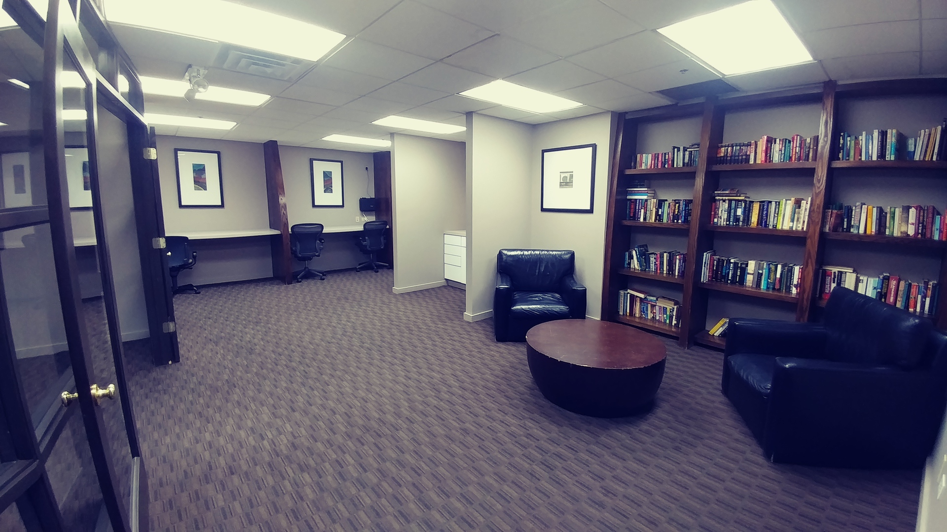 5320 North Sheridan Road, Unit 1207 Chicago, IL 60640 - Photo 19 of 20 a living room with furniture and a book shelf