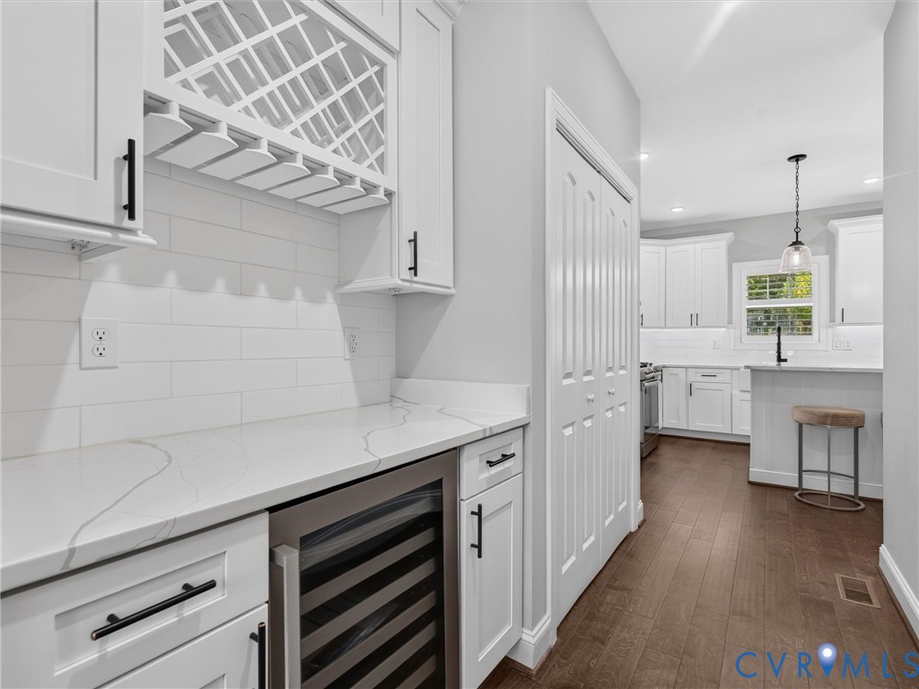 9011 Midway Road Henrico, VA 23229 - Photo 12 of 65 White cabinetry with integrated wine rack and glas