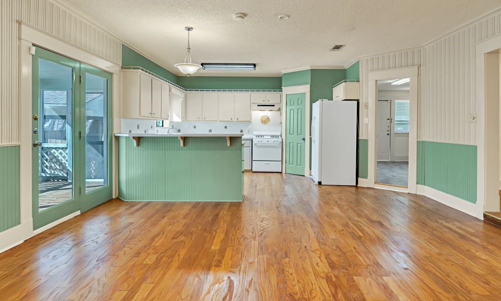 106 30th Street North Waco, TX 76710 - Photo 12 of 47 a view of a kitchen with wooden floor and a kitchen