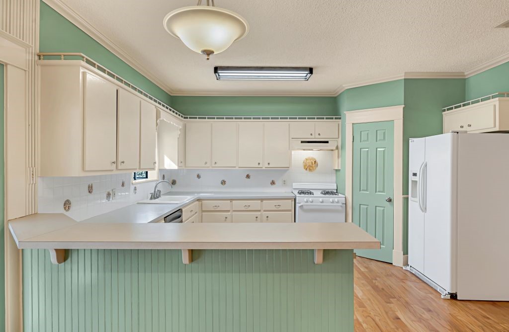 106 30th Street North Waco, TX 76710 - Photo 13 of 47 a kitchen with stainless steel appliances a refrigerator sink and cabinets