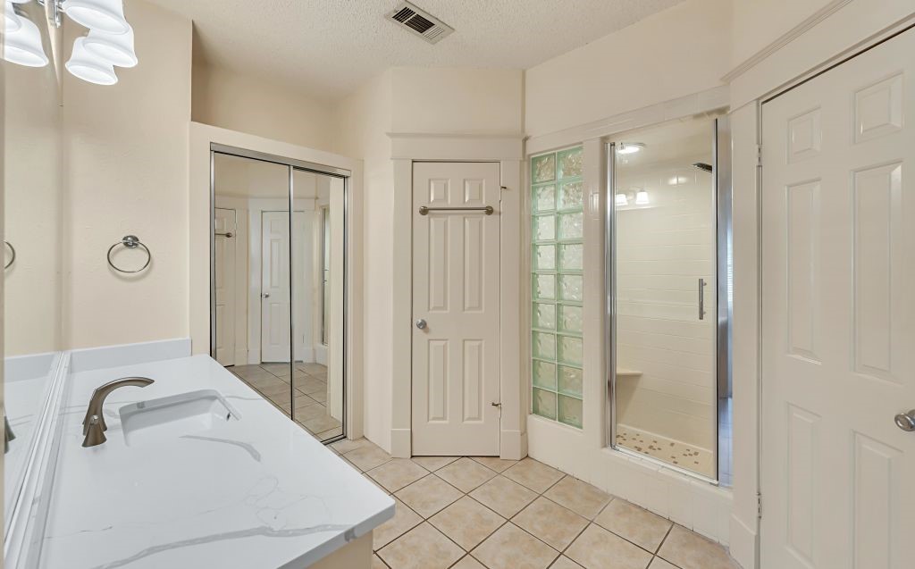 106 30th Street North Waco, TX 76710 - Photo 21 of 47 a bathroom with a tub shower and sink