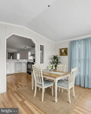 a view of a livingroom with a ceiling fan and window