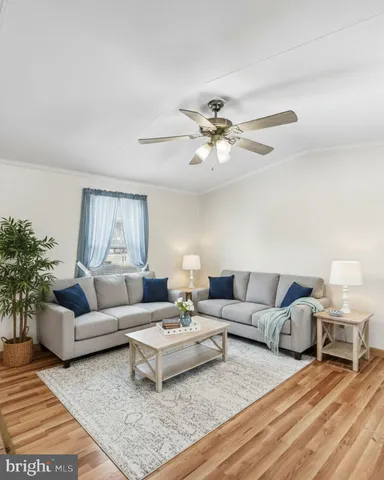 a kitchen with granite countertop a stove and white cabinets