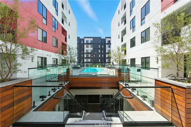 a view of building with a swimming pool