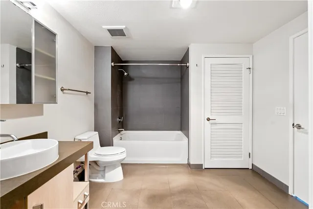 a bathroom with a sink a mirror and a bathtub
