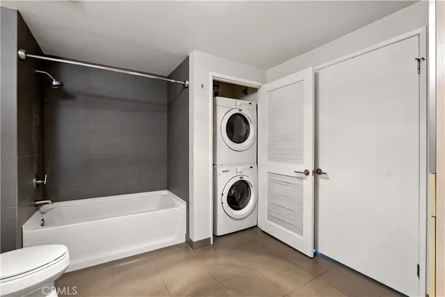 a view of a hallway with washer and dryer