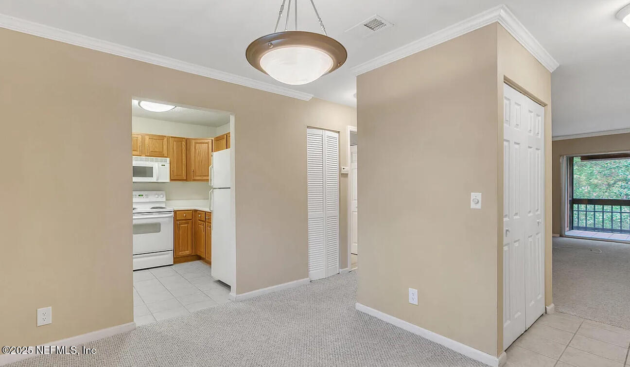 8880 Old Kings Road South, Unit 72 Jacksonville, FL 32257 - Photo 11 of 11 a view of a kitchen and a sink dishwasher and a refrigerator