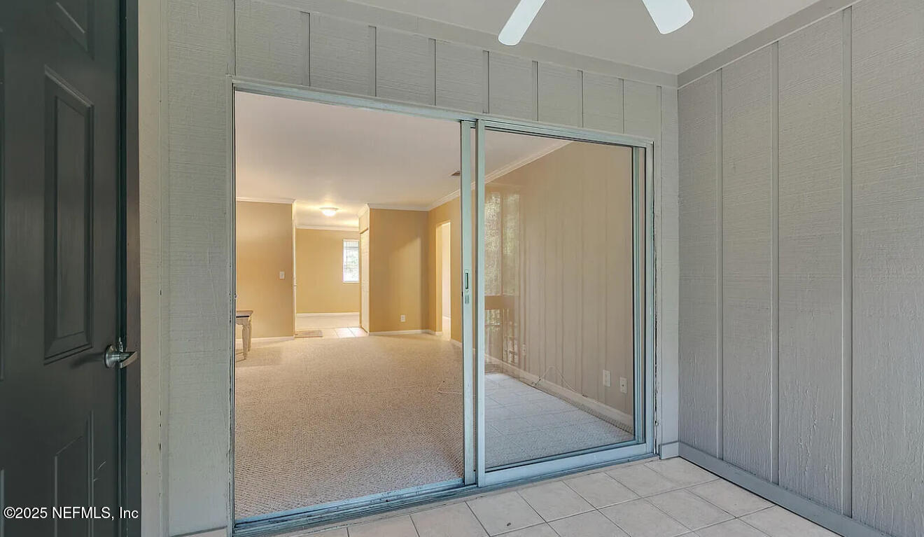 8880 Old Kings Road South, Unit 72 Jacksonville, FL 32257 - Photo 2 of 11 a view of a hallway with wooden floor
