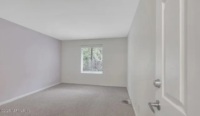 a bathroom with a shower and a toilet