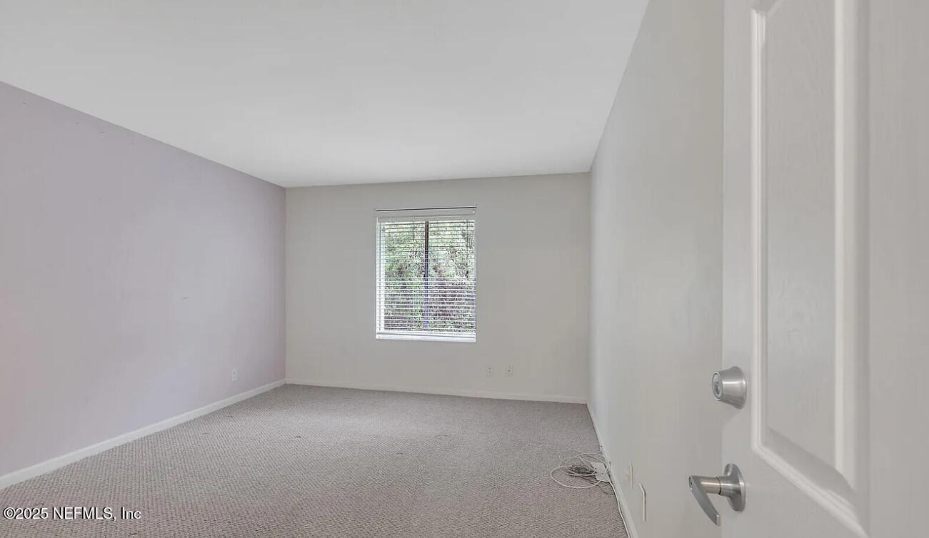 8880 Old Kings Road South, Unit 72 Jacksonville, FL 32257 - Photo 7 of 11 a view of an empty room with a window