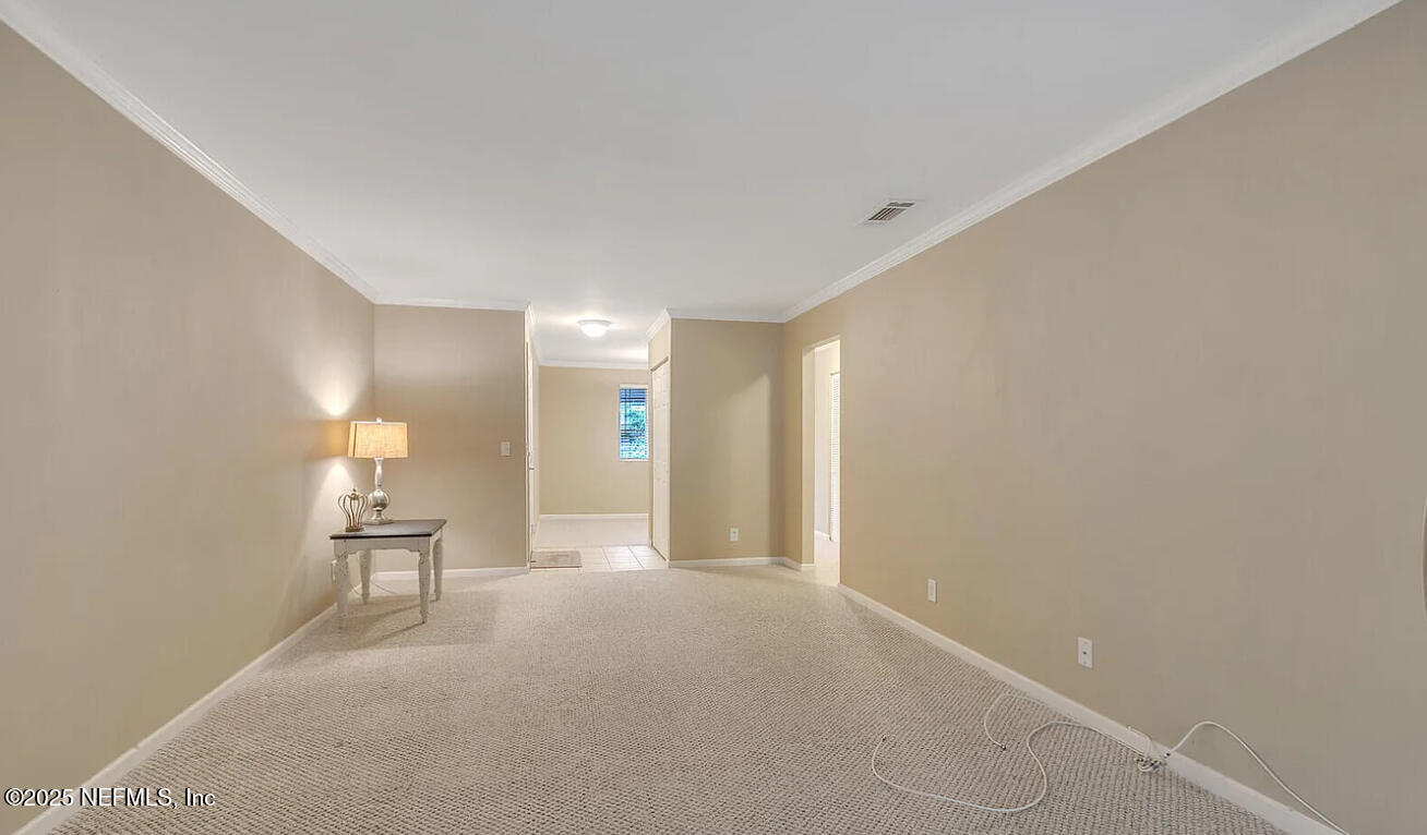 8880 Old Kings Road South, Unit 72 Jacksonville, FL 32257 - Photo 8 of 11 a very nice looking room with a chair