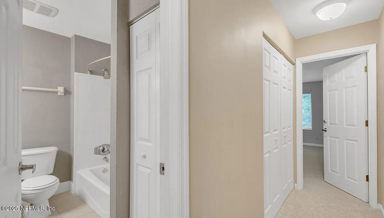 8880 Old Kings Road South, Unit 72 Jacksonville, FL 32257 - Photo 9 of 11 a bathroom with a shower and a toilet