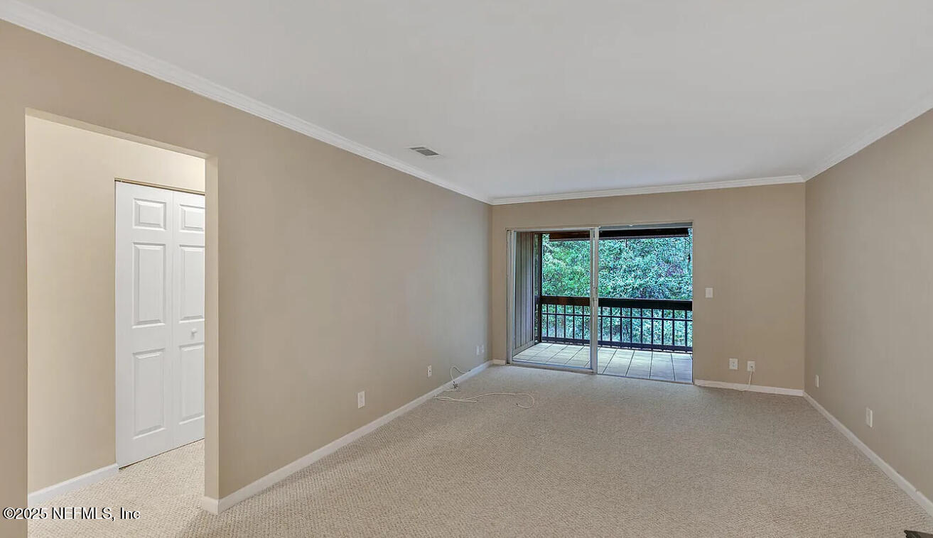 8880 Old Kings Road South, Unit 72 Jacksonville, FL 32257 - Photo 10 of 11 a view of a room with a large window