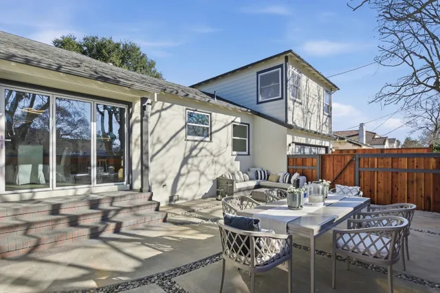 a outdoor living space with furniture and a potted plant