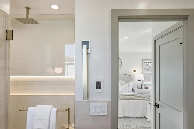 a backyard of a house with wooden fence and trees