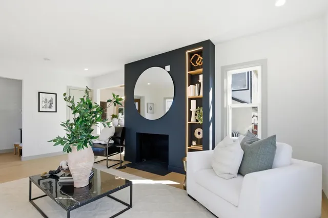 a kitchen with stainless steel appliances granite countertop a refrigerator a stove and a sink