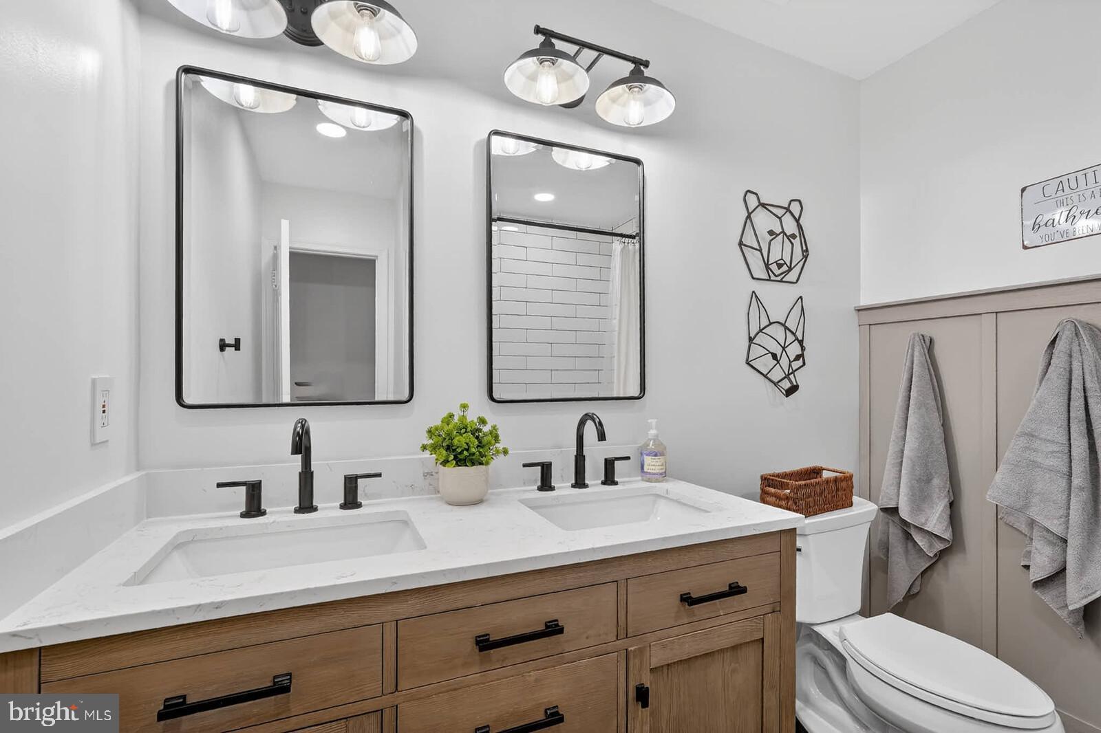 500 Finsbury Road Silver Spring, MD 20904 - Photo 29 of 54 a bathroom with a granite countertop sink mirror vanity and toilet