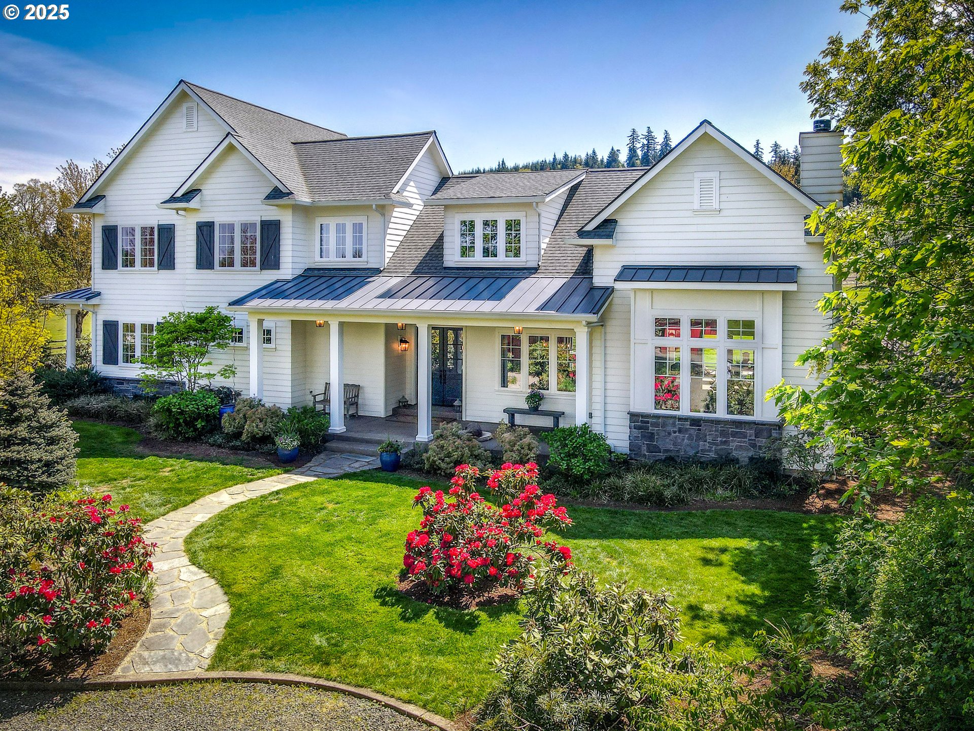 a front view of a house with garden