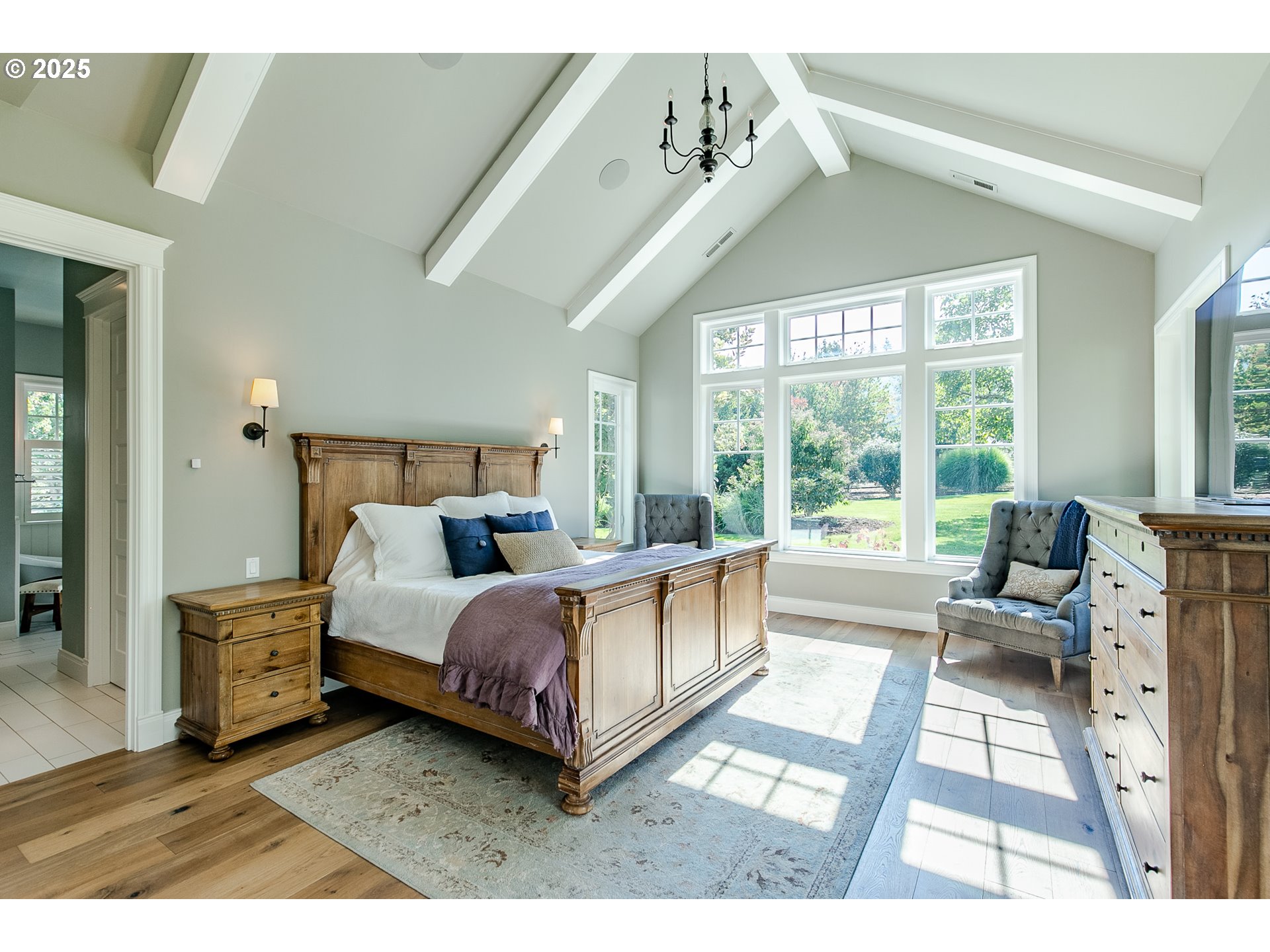 27716 Erickson Road Eugene, OR 97402 - Photo 11 of 40 a bed room with a bed and a large window