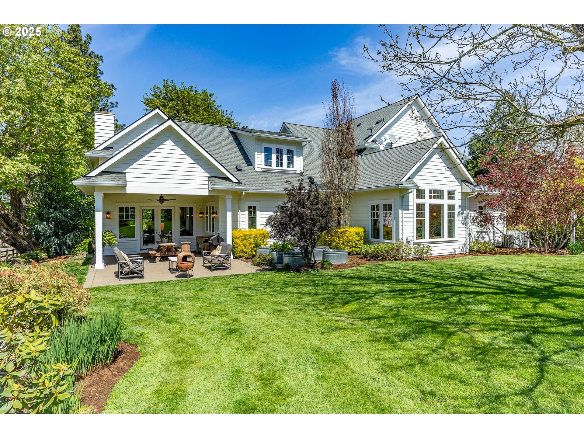 27716 Erickson Road Eugene, OR 97402 - Photo 25 of 40 a front view of a house with patio and garden