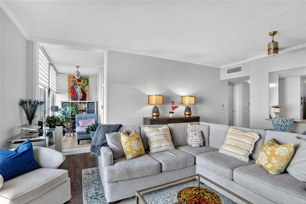 130 26th Street Northwest, Unit 804 Atlanta, GA 30309 - Photo 11 of 25 a living room with furniture or couch and a couch